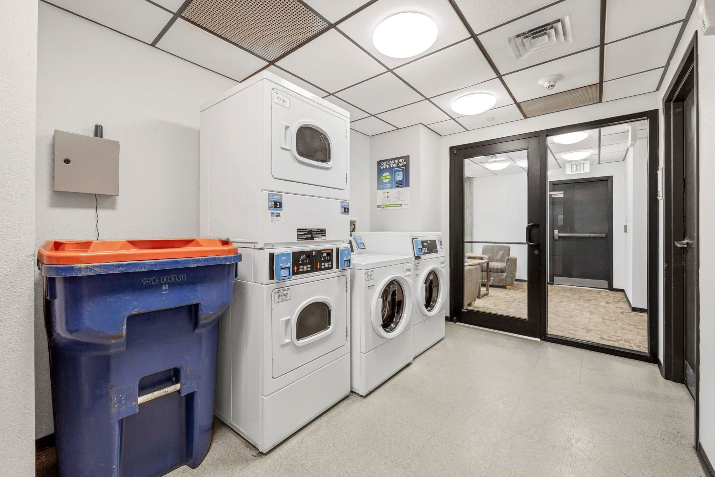 Communal laundry room with washers and dryers