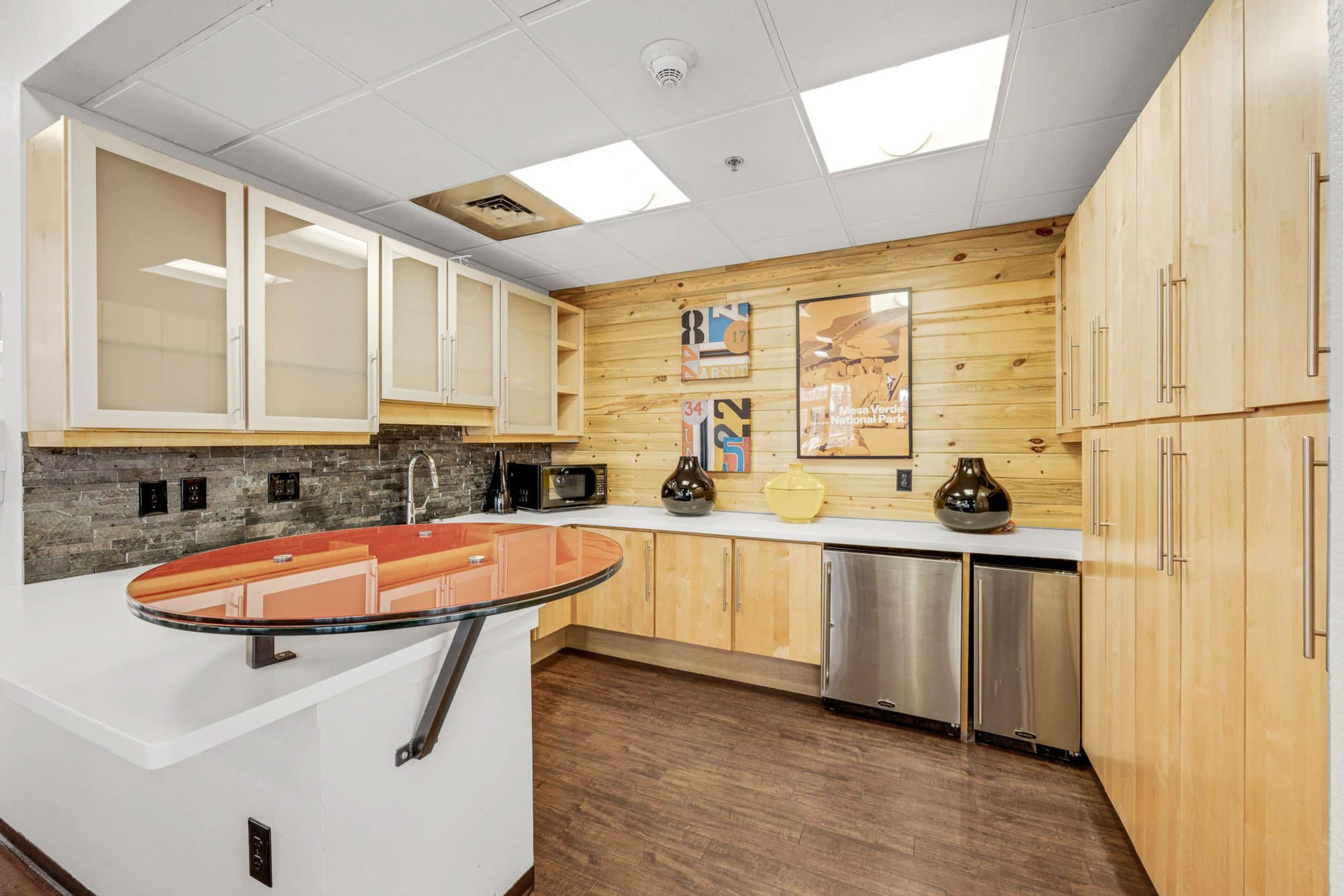 Community kitchen area with cupboards and counters